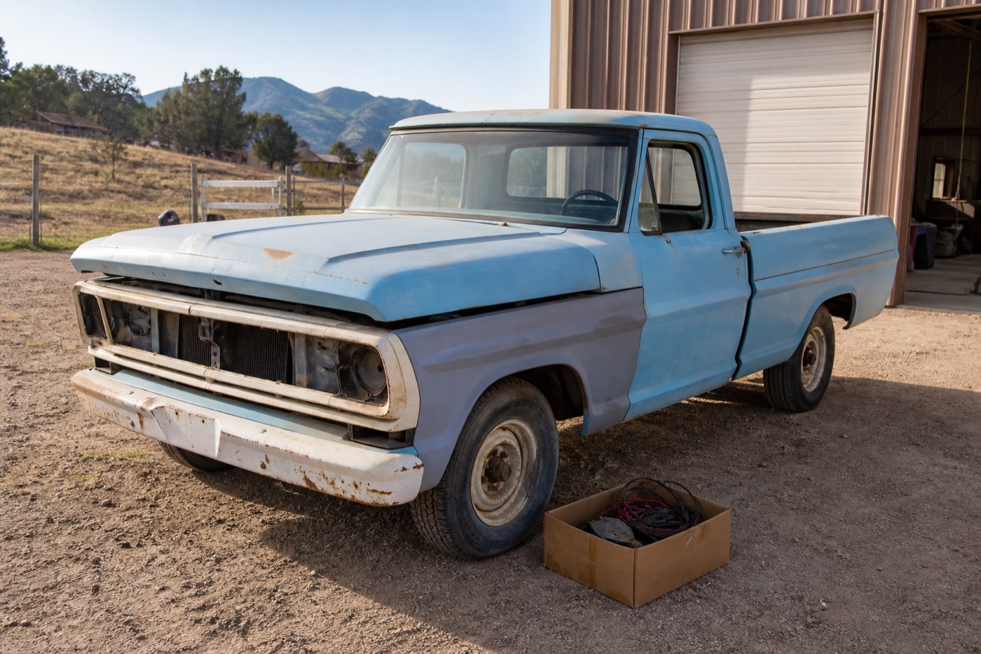 Partially finished pale blue 1972 Ford F-100 project truck with wiring parts